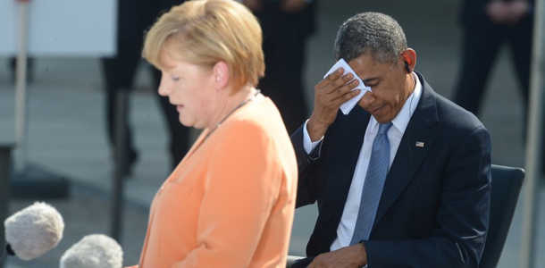 Обама и Меркель договорились сохранить санкции и давление на Россию
